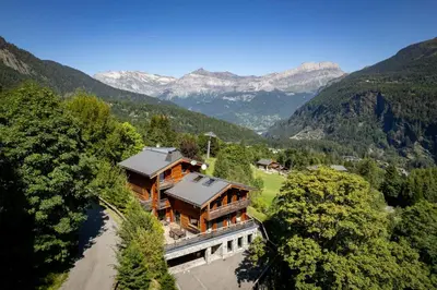 an aerial view of a house in the mountains at Chalet Kuma in Les Houches