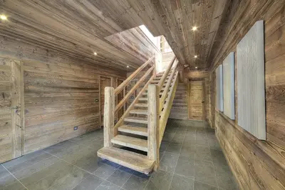 a wooden staircase in a room with wooden walls at Chalet Norel in Les Houches