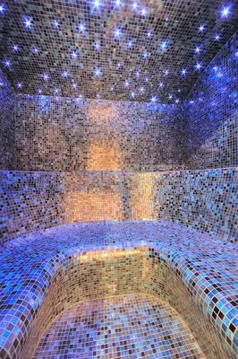 a large tiled room with a ceiling with blue lights at Chalet Norel in Les Houches