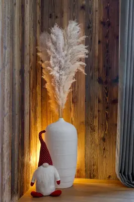 two stuffed animals sitting next to a white vase at Appartement Élégance Mont Blanc - Welkeys in Combloux
