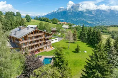 an aerial view of a house in the mountains at Appartement Élégance Mont Blanc - Welkeys in Combloux