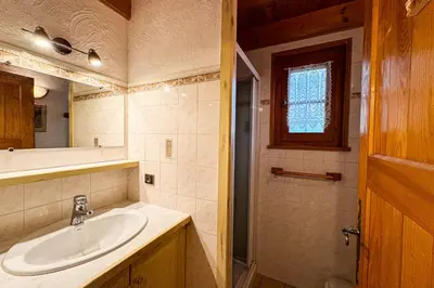 a bathroom with a sink and a mirror at Chalet facing Mont Blanc calm and comfort in Saint-Gervais-les-Bains
