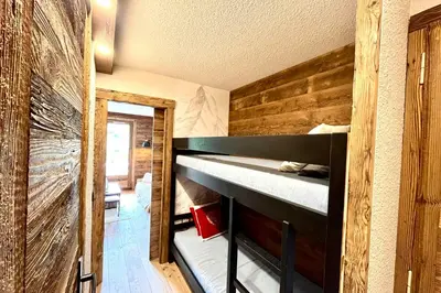 a bedroom with a bunk bed in a house at Apartment Les Cimes Blanches in Combloux