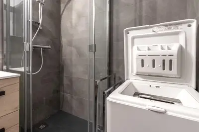 a bathroom with a shower with a sink at Duplex - Aiguille du Midi - Centre in Chamonix-Mont-Blanc