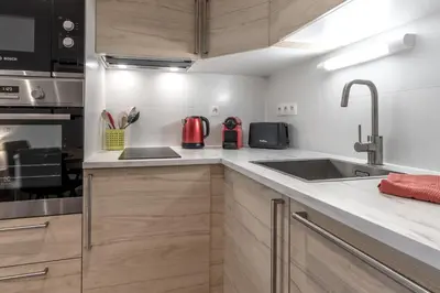 a kitchen with a sink and a counter top at Duplex - Aiguille du Midi - Centre in Chamonix-Mont-Blanc