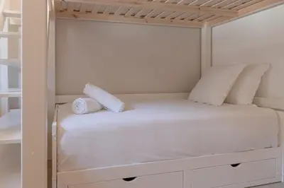 a white bunk bed with two pillows on it at Rocher Blanc - Rénové - Spacieux - 4pax in Passy