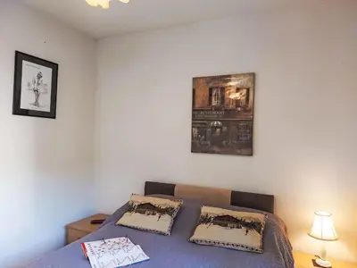 a teddy bear sitting on a bed with some drawings at Apartment Domaine de Crespin-5 by Interhome in Saint-Gervais-les-Bains