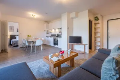 a living room with a couch and a table at Apartment Arbois in Saint-Gervais-les-Bains