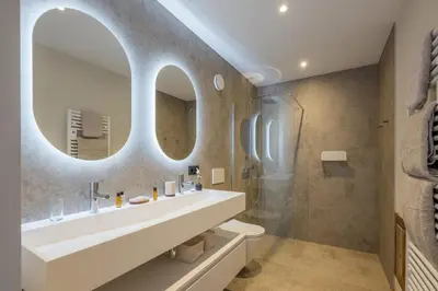 a bathroom with a sink and a mirror at Chalet Diane I Luxe I Proche des pistes in Combloux