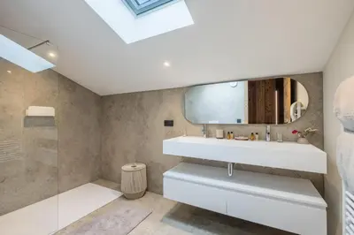 a bathroom with a sink and a mirror at Chalet Diane I Luxe I Proche des pistes in Combloux