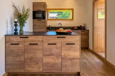 a kitchen with a counter with a bowl of fruit on it at L'Ecrin in Plateau dʼAssy