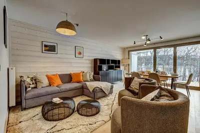 a living room with a couch and chairs and a table at White Pearl - Centre de Chamonix - 2ch - Renove in Chamonix-Mont-Blanc