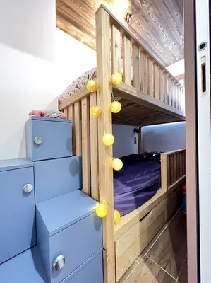 a bedroom with a bunk bed with yellow lemons on it at Megève appartement centre ville palais des sports in Megève