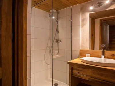 a bathroom with a shower and a sink at Demi-Chalet en plein coeur de Chamonix - Gabi in Chamonix-Mont-Blanc