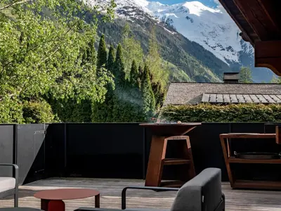 a balcony with a view of a mountain at Chalet Bonami 450 m2 salle cinema jacuzzi hammam in Chamonix-Mont-Blanc