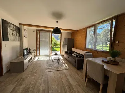 a living room with a couch and a table at Agora in Samoëns