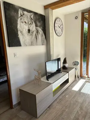 a living room with a wolf painting on the wall at Agora in Samoëns