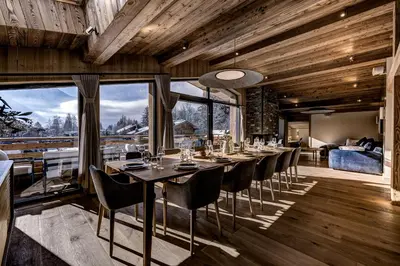 a dining room with a long table and chairs at Chalet Josephine, Chamonix Les Bois in Chamonix-Mont-Blanc