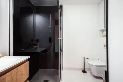 a bathroom with a shower with a sink and a toilet at Apartment Nid des Neiges - Perfect for families in Combloux