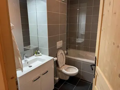 a bathroom with a toilet and a sink and a shower at Bel appartement T3 en résidence neuve avec parking et WIFI, proche du village et ski-bus - FR-1-624-168 in Samoëns