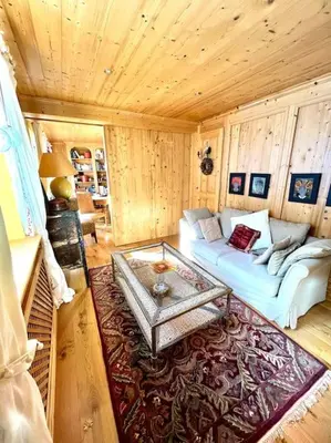 a living room with a couch and a coffee table at Très bel appartement à Megève in Megève