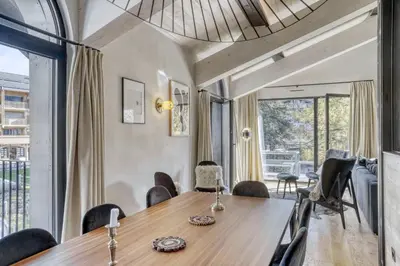a dining room with a table and chairs at Appartement Orso in Megève