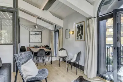 a dining room with a table and chairs at Appartement Orso in Megève