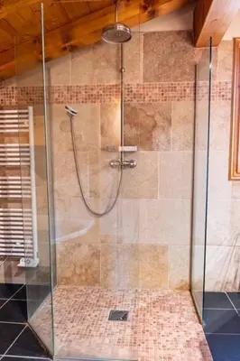 a shower with a glass door in a bathroom at Premium 200sqm Chalet in Chamonix Valley ! in Chamonix-Mont-Blanc