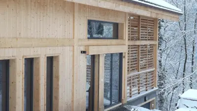 a house under construction in the snow at Chalet lux et Design Chamonix in Servoz