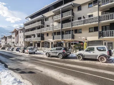 a group of cars parked in front of a building at Studio La Comtesse-11 by Interhome in Saint-Gervais-les-Bains