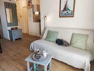 a living room with a couch and a table at Studio La Comtesse-11 by Interhome in Saint-Gervais-les-Bains