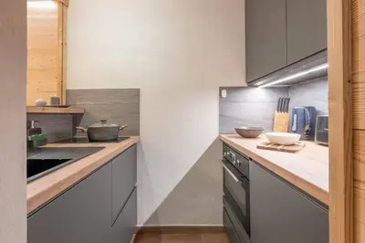 a kitchen with a counter with bowls on it at Chamois Blanc - Quiet Studio close to the town centre - By Cozee Rentals in Chamonix-Mont-Blanc