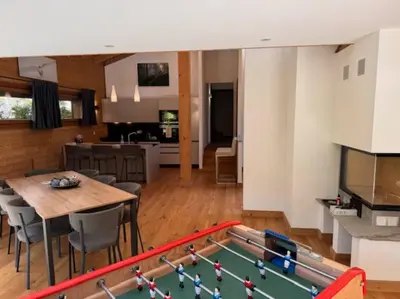 a living room with a ping pong table at Superbe chalet vallée de Chamonix in Chamonix-Mont-Blanc