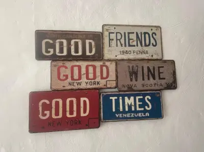 a group of old signs hanging on a wall at Grand Studio à 300m du pied des pistes, in Megève