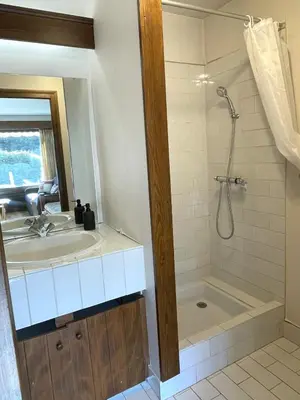 a bathroom with a tub and a sink and a shower at Grand Studio à 300m du pied des pistes, in Megève