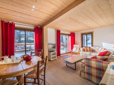 a living room with a couch and a table at Appartement 3 chambres avec terrasse au cœur de Megève - FR-1-453-316 in Megève