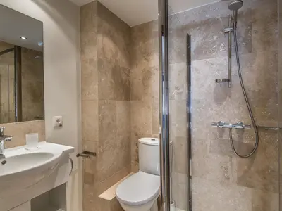 a bathroom with a shower and a toilet and a sink at Appartement 3 chambres avec terrasse au cœur de Megève - FR-1-453-316 in Megève