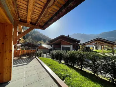 a porch of a house with a view of a mountain at Appartement lumineux avec parking à Samoëns, animaux admis - FR-1-624-170 in Samoëns