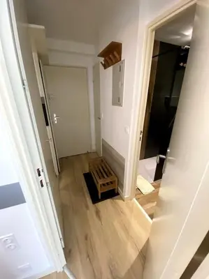 a view of a hallway with a stairway in a house at Appt Cosy au centre Chamonix in Chamonix-Mont-Blanc