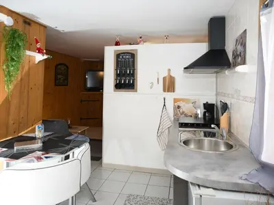 a kitchen with a sink and a counter at La Charlotte in Sallanches