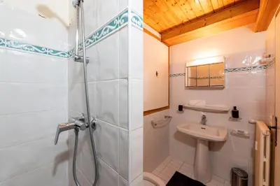 a bathroom with a shower and a sink at Appartement des Cristaux - Welkeys in Megève