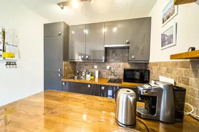 a kitchen with a counter with a coffee maker on a table at Apartment with mountain view in Saint-Gervais in Saint-Gervais-les-Bains