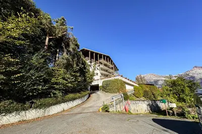 a house on the side of a road at Apartment with mountain view in Saint-Gervais in Saint-Gervais-les-Bains