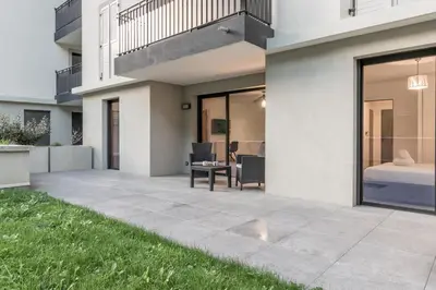 a patio in a house with a bed at Le 002 - Proche Telecabine - Terrasse in Saint-Gervais-les-Bains