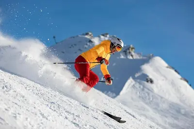 a person is skiing down a snow covered slope at Delice - City center Les Houches & Free Parking - By Cozee Rentals in Les Houches