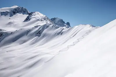 a snow covered mountain with a snow covered slope at Delice - City center Les Houches & Free Parking - By Cozee Rentals in Les Houches