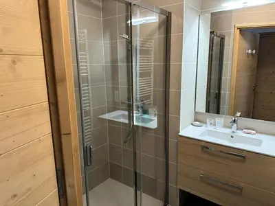 a bathroom with a glass shower and a sink at Chalet Flore - CHALET FLORE MAE-6641 in Combloux