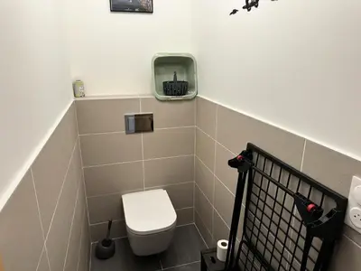 a small bathroom with a toilet and a sink at Chalet Flore - CHALET FLORE MAE-6641 in Combloux