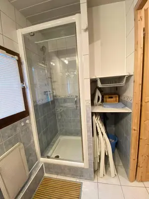 a shower with a glass door in a bathroom at Studio in Arâches-la-Frasse