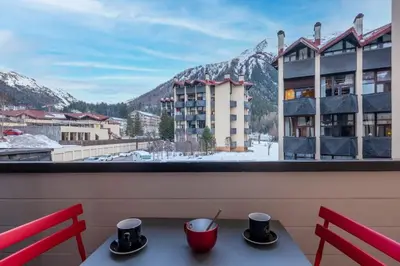 a bedroom with two bunk beds with towels at Ancolie - Apartment Free parking close to ski lift - By Cozee Rentals in Chamonix-Mont-Blanc